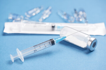 Medical glass vials and syringe for vaccination. Drug or vaccine for treatment, flu in laboratory,...