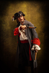 Fototapeta na wymiar Portrait of a pirate, holding two musket pistol in his hands