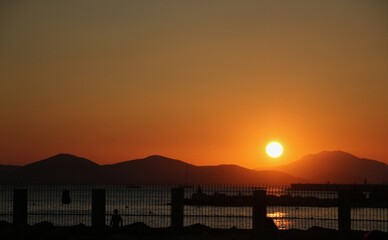 Naklejka na ściany i meble Sunset at the beach, in Greece.