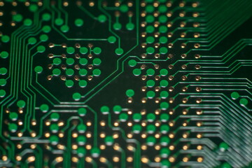 macro photo of printed circuit board with golden BGA pads