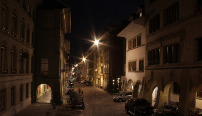 Fototapeta na wymiar Bern, Switzerland - January 8, 2020: old city street at night