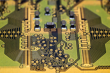 Macro photo of golden printed circuit board of high-speed memory module. Example of fine pitch PCB...
