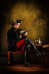 Fototapeta na wymiar Portrait of a privateer cleaning his musket gun, sitting in his cabin