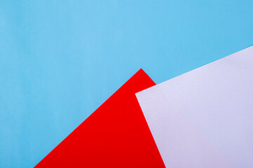 White, blue, red and pastel colorful texture background of fashion papers in memphis geometry style.