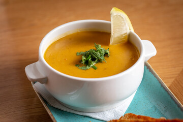 lentil soup, with crackers and lemon