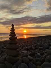 Rocks stacked at sunset