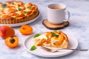 Apricot mascarpone tart, on blue background.