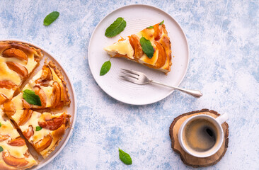 Apricot mascarpone tart, on blue background.