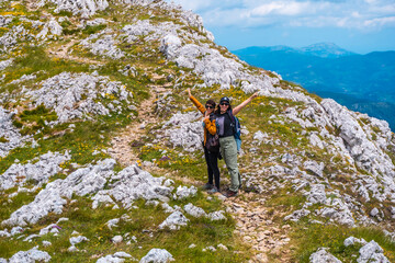 Mount Aizkorri 1523 meters, the highest in Guipuzcoa. Basque Country. Ascent through San Adrian and return through the Oltza fields. Two sisters about to reach the top happy