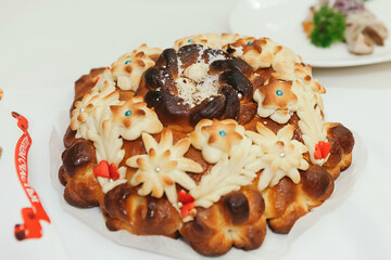 Wedding traditional ruddy loaf stands on the table