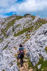 Mount Aizkorri 1523 meters, the highest in Guipuzcoa. Basque Country. Ascent through San Adrian and return through the Oltza fields. A young woman finishing the trek almost at the top