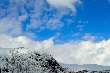 Fototapeta na wymiar blue sky and snowy mountain