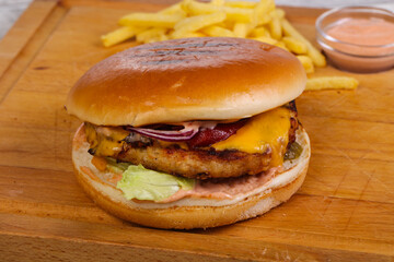 Burger with chicken, cheese and red onion