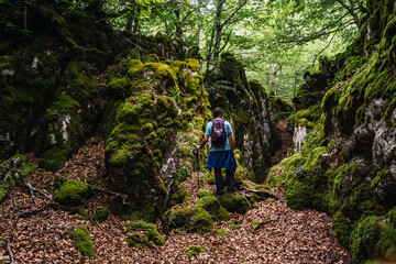 Mount Aizkorri 1523 meters, the highest in Guipuzcoa. Basque Country. Ascent through San Adrian and return through the Oltza fields. A young man in a beautiful spot in the forest of Mount Aizkorri