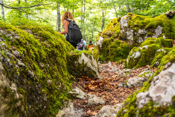 Mount Aizkorri 1523 meters, the highest in Guipuzcoa. Basque Country. Ascent through San Adrian and return through the Oltza fields. Young people walking in the forest of Mount Aizkorri