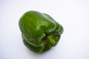 Side view of  Single Green capsicum or Green bellpepper on white background