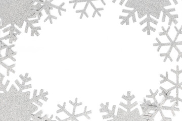 Christmas frame. Christmas decorations and snowflakes on isolated white background. Snowflakes frame with copy space