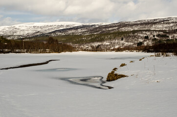 frozen river and mountain landscape