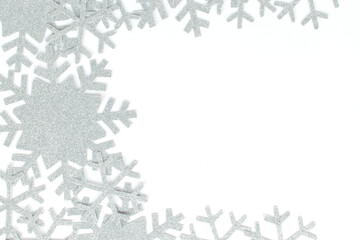 Christmas frame. Christmas decorations and snowflakes on isolated white background. Snowflakes frame with copy space