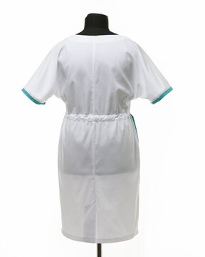 Female medical gown on a mannequin for clothes on a white background, rear view