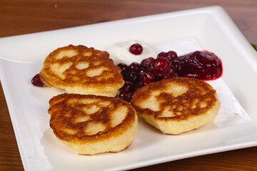 Pancakes with jam and berries