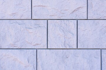 Texture of decorative bricks for finishing the facade of a house with a white tint