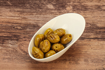 Green grilled olives in the bowl