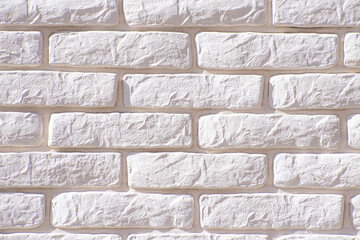 Texture of decorative bricks for finishing the facade of a house with a white tint