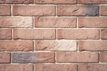 Texture of decorative bricks for finishing the facade of a house with a light brown shade