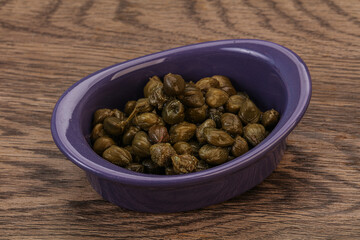 Tasty capers in the bowl