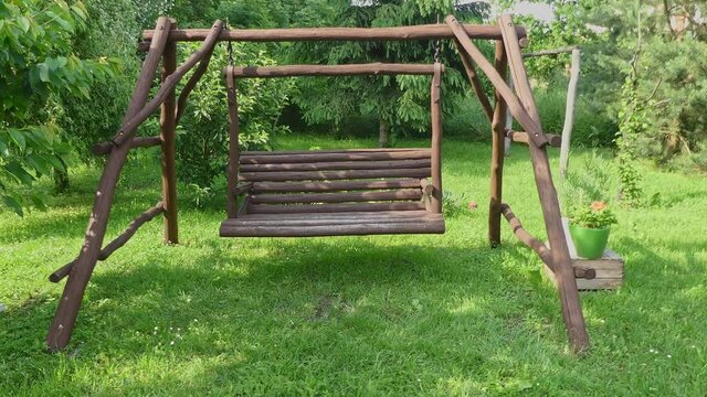 wooden swing in garden