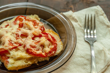 home-cooked potato casserole with tomatoes and cheese