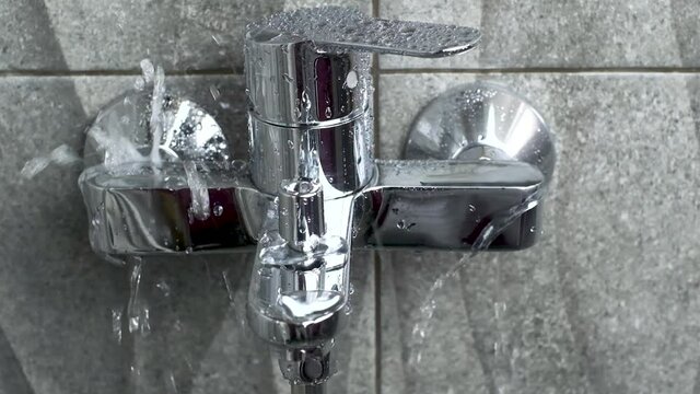 Close up Plumber Fixing repair a water leaking tap Faucet by Adjustable wrench , DIY job hous keep work fix leak repair.