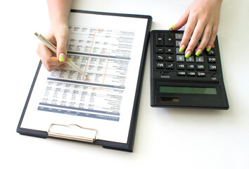 Top view of business woman's hands on table sheet. Finance and business concept.