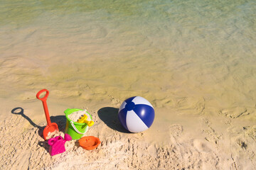 Fototapeta na wymiar Plastic toys at the beach