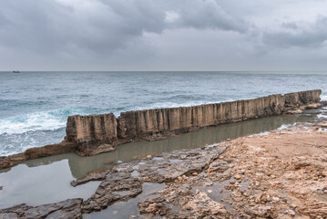Remains of Phoenician wall in historic Batroun coastal city in Batroun District, Lebanon