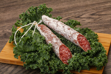 Spanish Fuet sausage with salad leaves