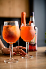 view on two glasses of cold orange drink stand on the kitchen table.
