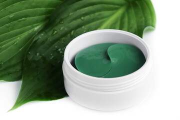 caring and caring for the face. cosmetic hydrogel patches for moisturizing and nourishing the skin around the eyes on a light background.