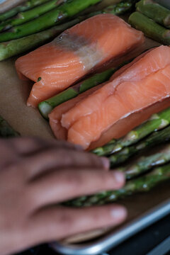 hand holding asparagus