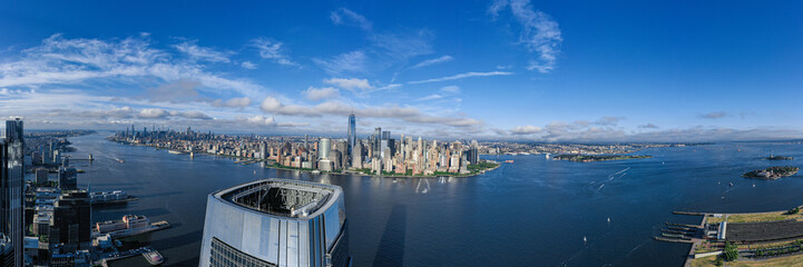 Fototapeta premium Aerial panorama of New York City skyline with both Jersey City and downtown Manhattan from Hudson River 