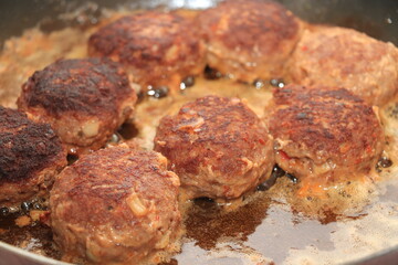 Frying meatballs in pan