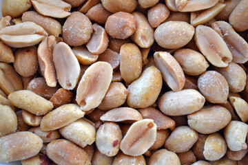 Close up of peeled and salted peanuts.