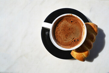 A cup of greek or turkish coffee and a sippet from above.