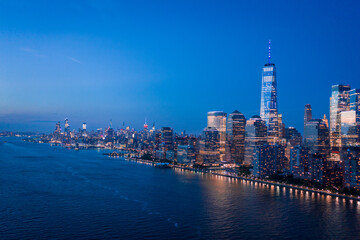 Aerial view of lower Manhattan at dusk from Hudson river. 