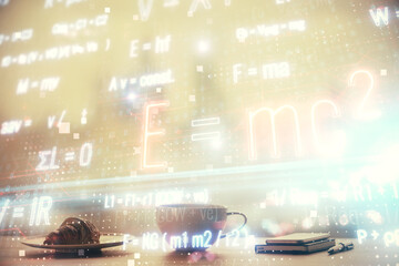 Double exposure of formula drawing hologram over coffee cup background in office. Concept education.