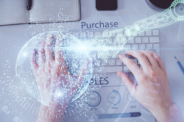 Multi exposure of man's hands typing over computer keyboard and data theme hologram drawing. Top view. Technology concept.