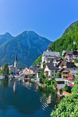 Fototapeta na wymiar Hallstatt lake in Alps, German style houses, lake view,Alps, Austria