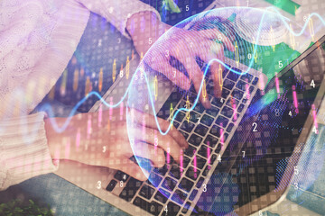 Double exposure of woman hands typing on computer and forex chart hologram drawing. Stock market invest concept.