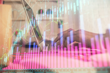 Double exposure of woman hands typing on computer and forex chart hologram drawing. Stock market invest concept.